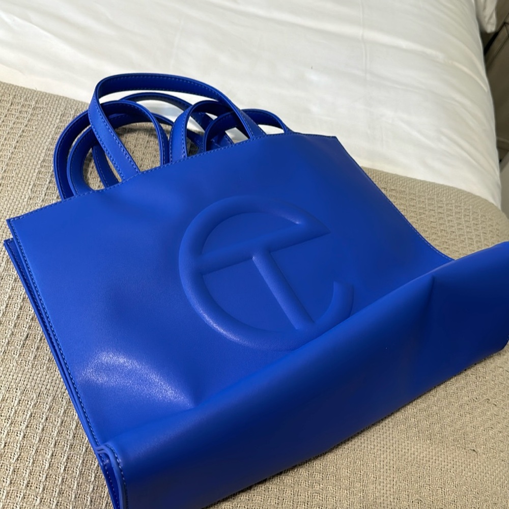 Medium blue Telfar shopping bag with dust bag